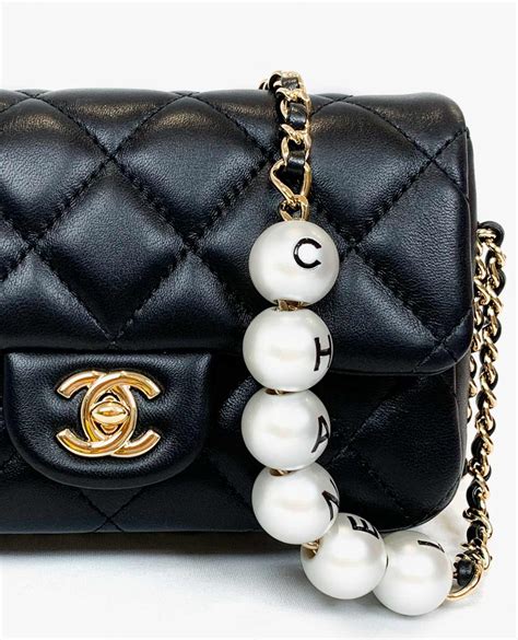 chanel lambskin pearl chain bag.